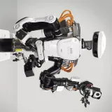 a humanoid alongside workers