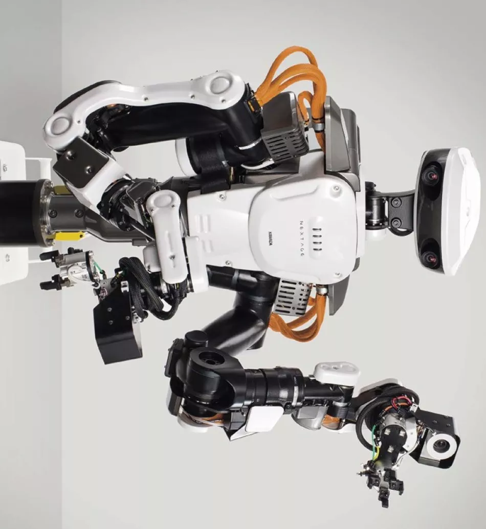 a humanoid alongside workers